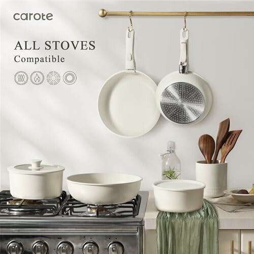 Cookware set on stove and hanging on wall