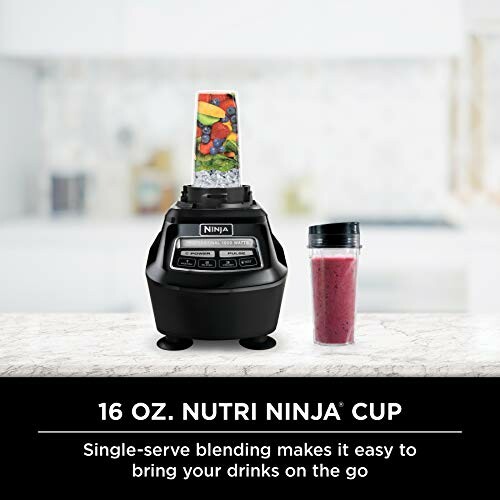 Nutri Ninja blender with a cup filled with smoothie ingredients.