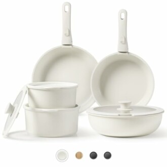 White cookware set with pots, pans, and lids.